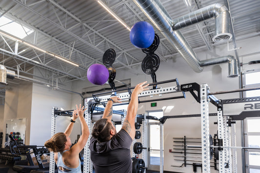Athletes tackle wall balls.