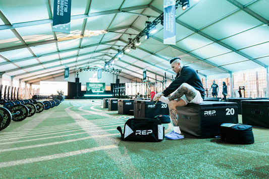 Athlete unloads their REP® Gym Bag.