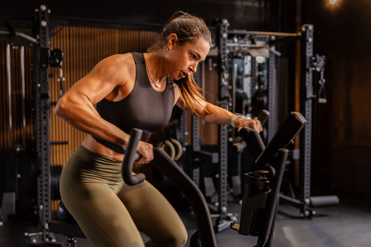 Athlete does sprint intervals on the Strive™ Air Bike featuring VPR™.