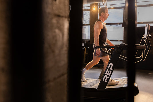 Athlete recovers on the Strive™ Curved Treadmill.