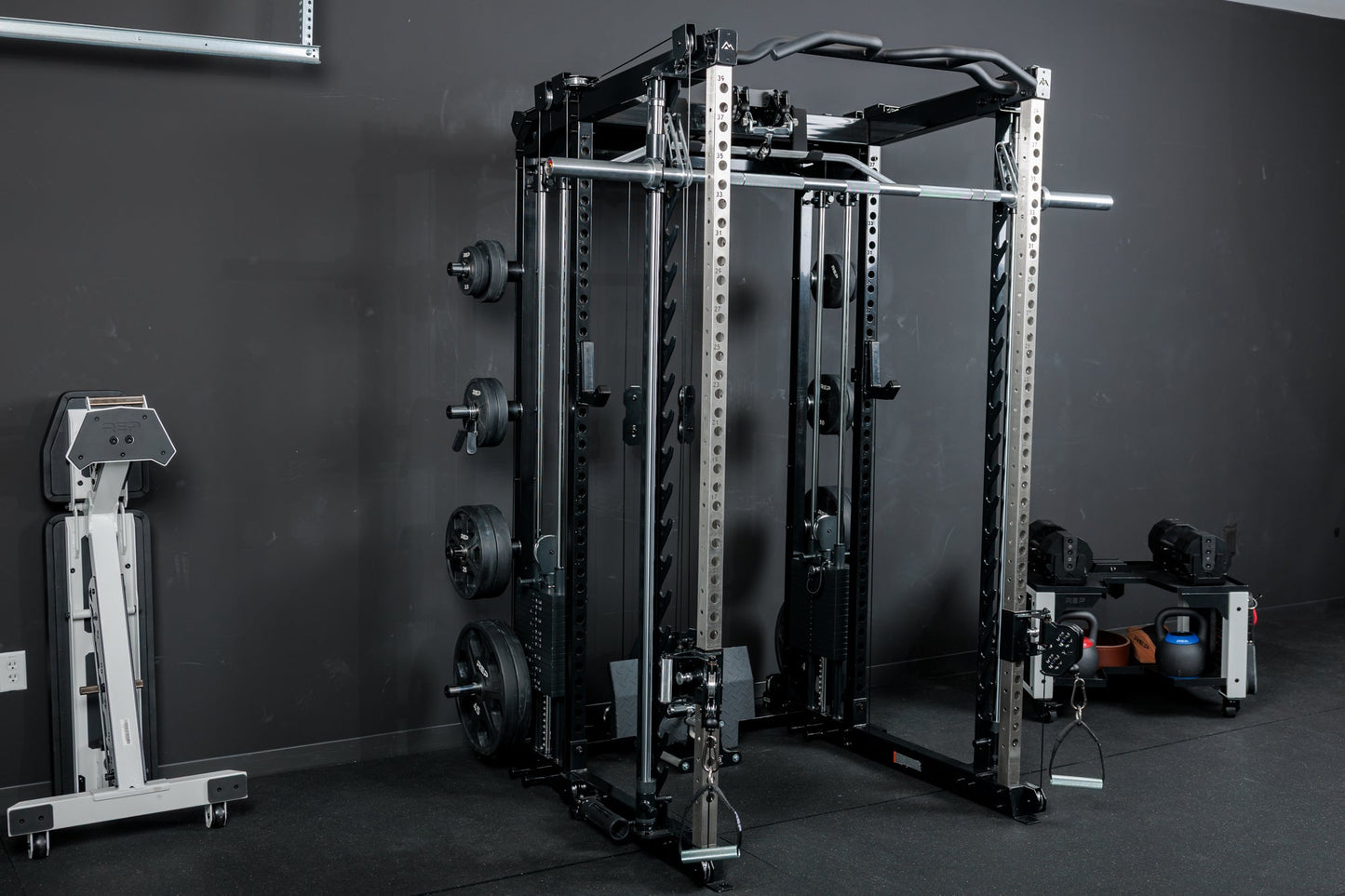 The REP Fitness Altitude™ Power Rack with both the Cable Attachment and Smith Machine Attachment in a home gym