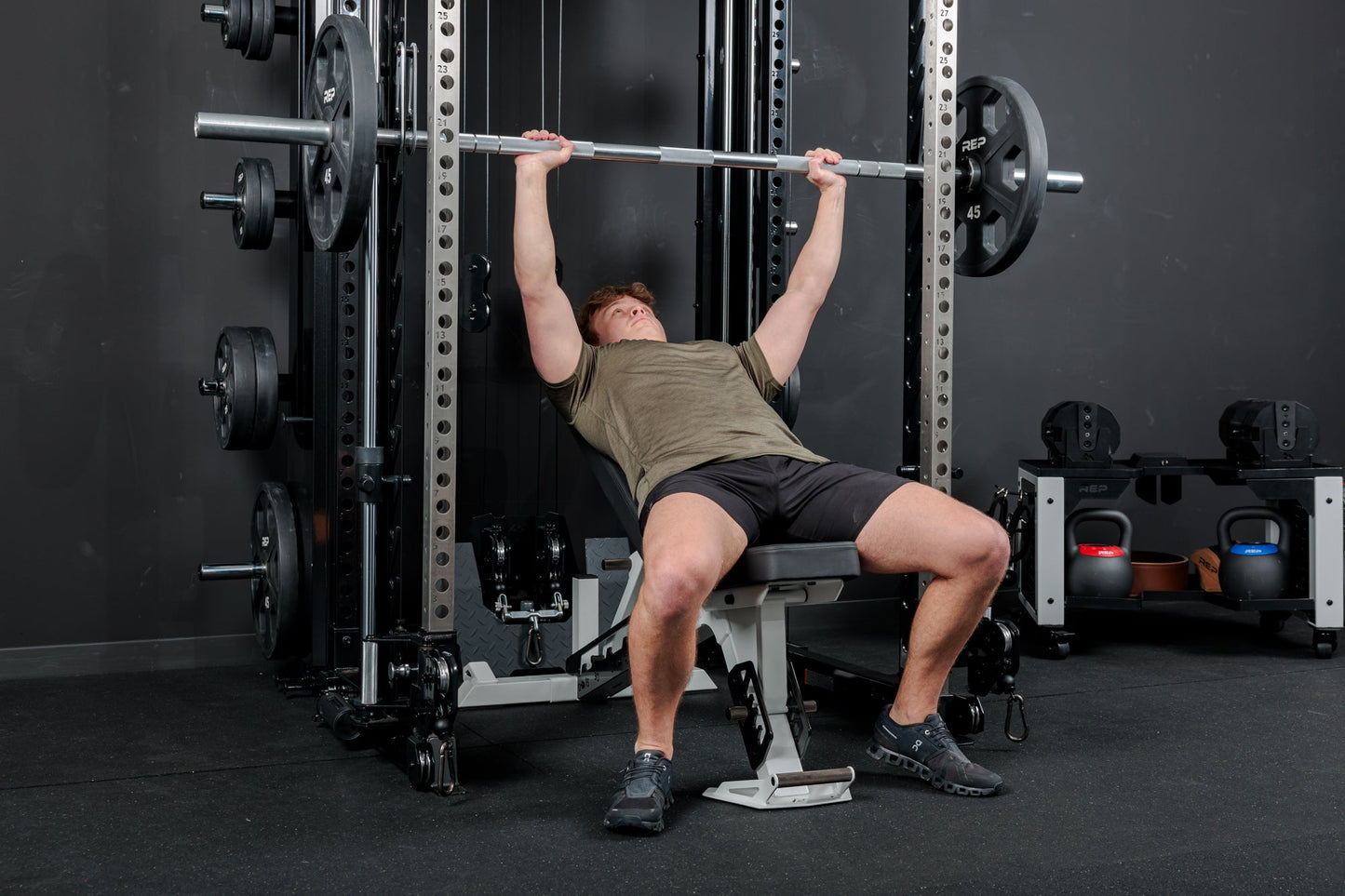 Athlete using the REP Fitness Altitude™ Power Rack Smith Machine Attachment for incline bench press