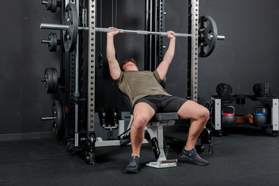 Athlete using the REP Fitness Altitude™ Power Rack Smith Machine Attachment for incline bench press