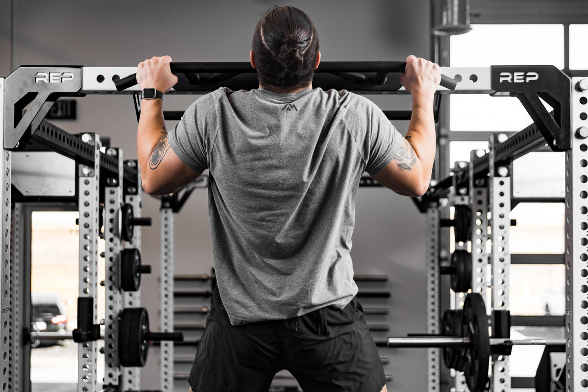 Athlete doing pull-ups on the Crossmember Multi-Grip Pull-Up Bar