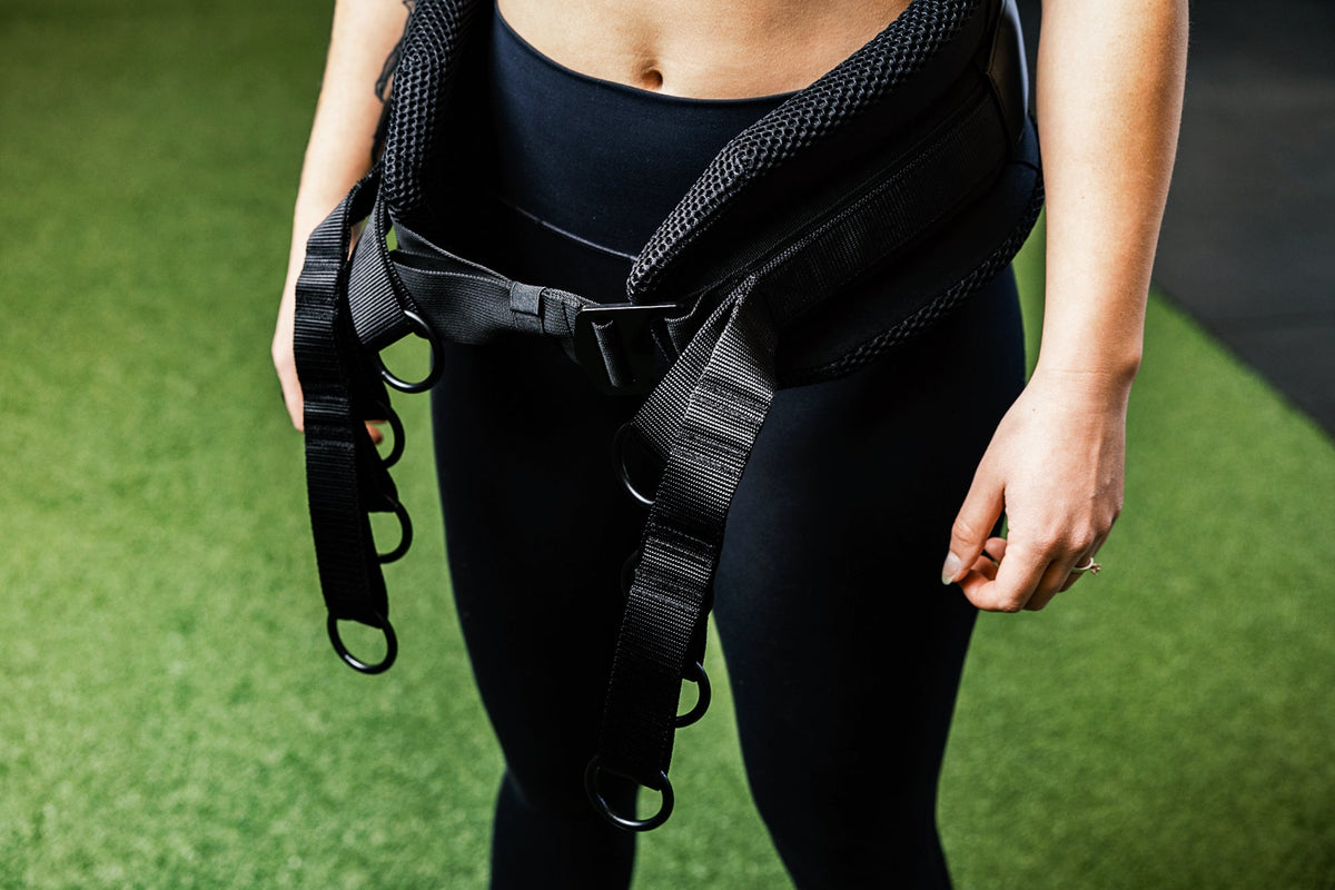 Person wearing the belt squat belt showing the o-rings for different length options