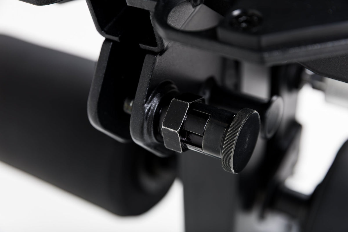 Close up of the lock-pin mechanism on the Leg Extension & Leg Curl Bench Attachment