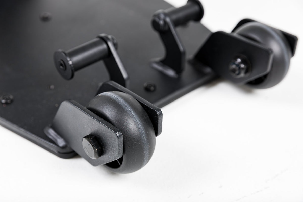 Close-up shot of the wheels on the Leg Extension & Leg Curl Bench Attachment