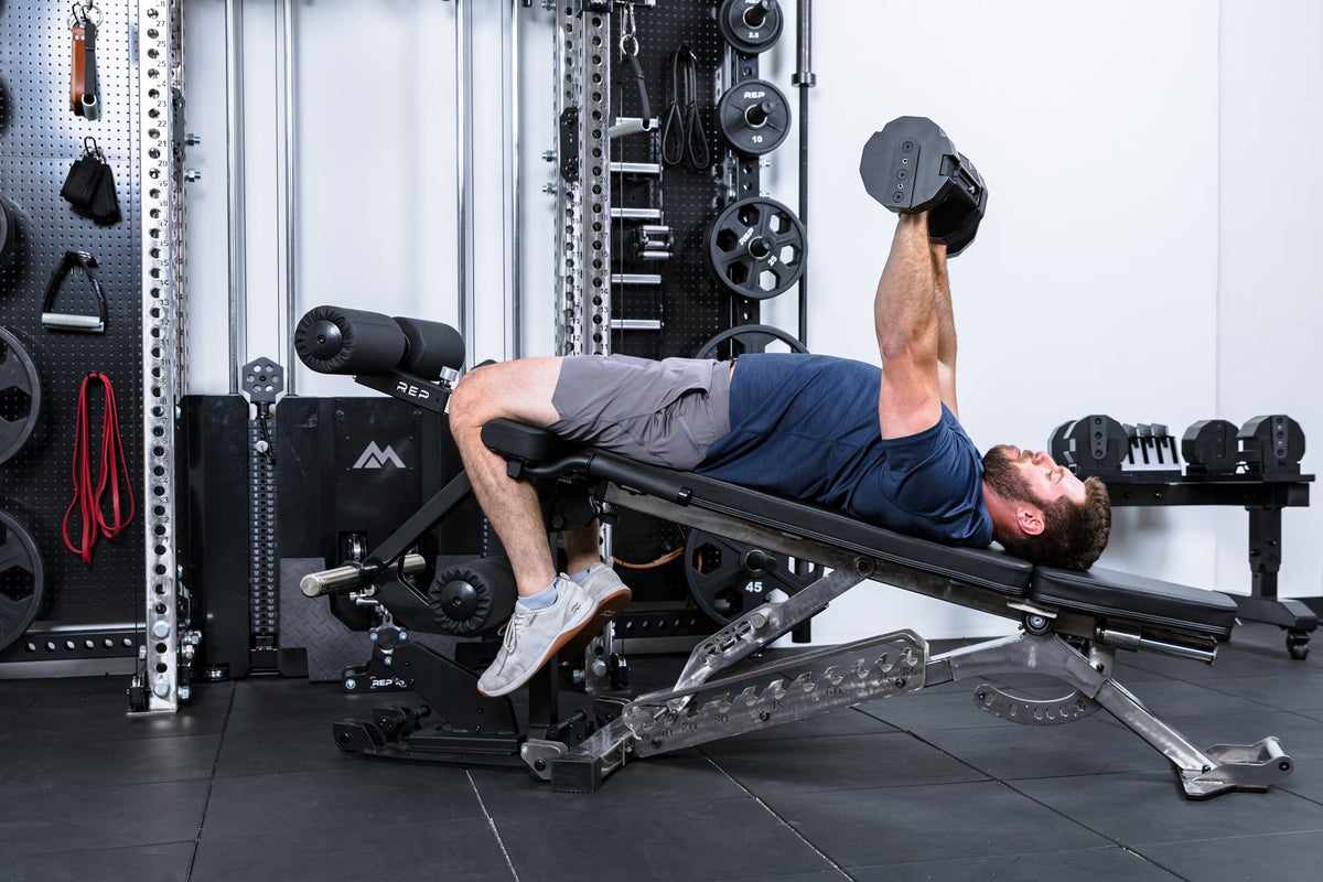 Athlete doing decline bench on the Leg Extension & Leg Curl Bench Attachment on a BlackWing