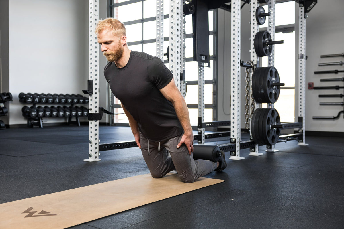 Athlete doing hamstring curls on the Leg Roller 2.0