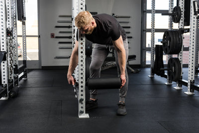 Athlete installing the Leg Roller 2.0
