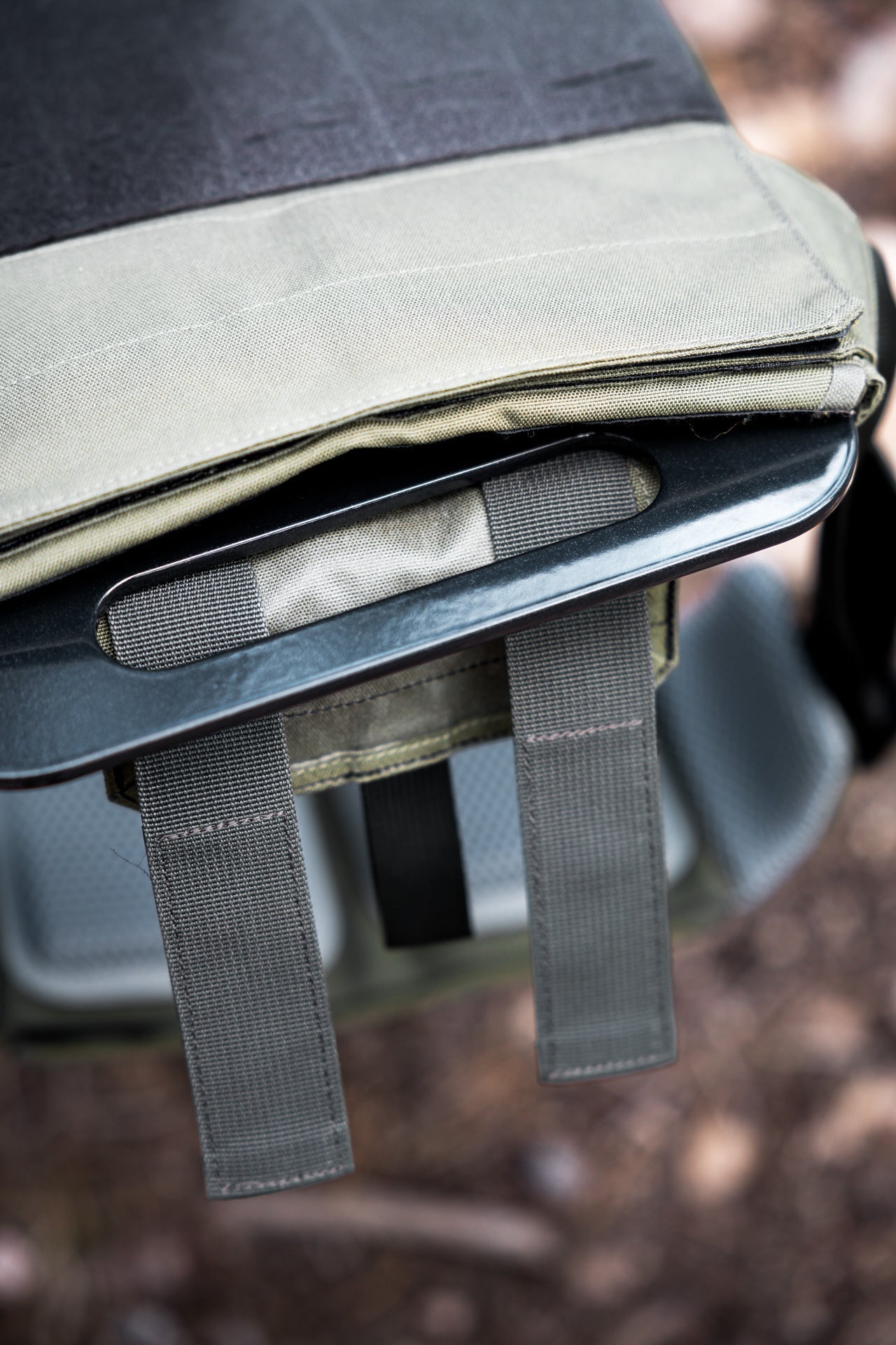 close up of the bottom handle on the Strata Weight Vest Plate