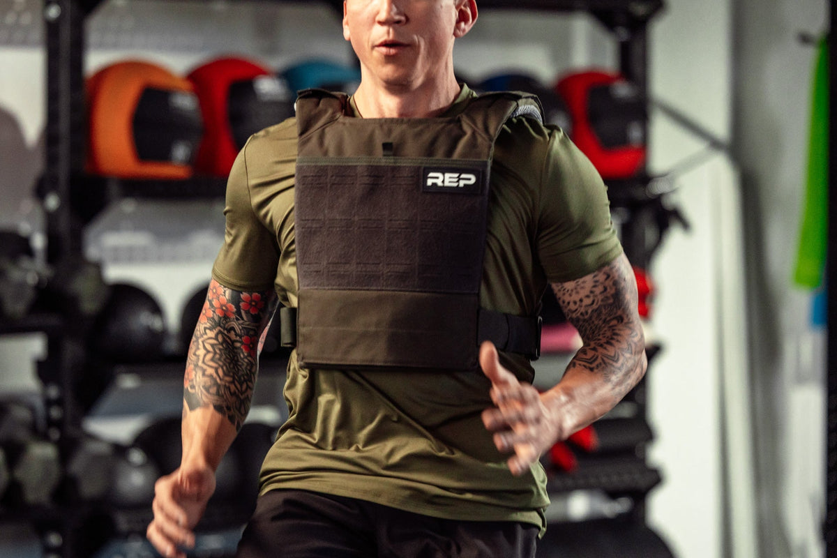 Athlete wearing the olive Strata Weight Vest running