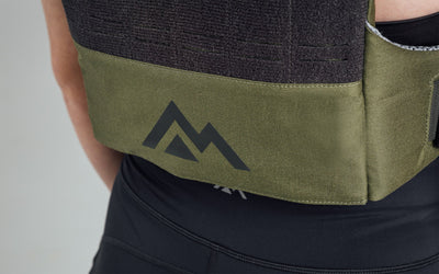 Mountain logo on the back bottom of the Strata Weight Vest